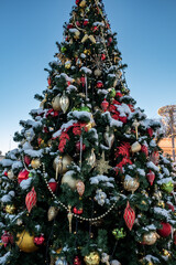 Christmas tree and New Year decorations on the town square on a frosty winter day.