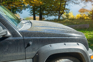 Fototapeta premium Black dirty car in the outdoors.