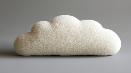 The cloud pillow is a plush and fluffy decorative throw pillow designed for kids' rooms, with its cloud shape and soft background making it a great addition to nursery decor