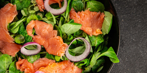 Salmon salad appetizer seafood fresh fish second course portion size natural product tasty snack fresh delicious gourmet food background on the table rustic top view copy space pescetarian diet