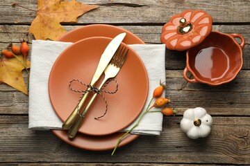 Beautiful table setting with autumn decor on wooden background, flat lay