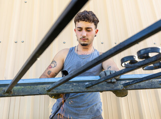 Trans man working with metal in daily life