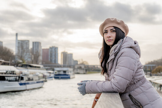 Woman by the Seine in Paris winter fashion