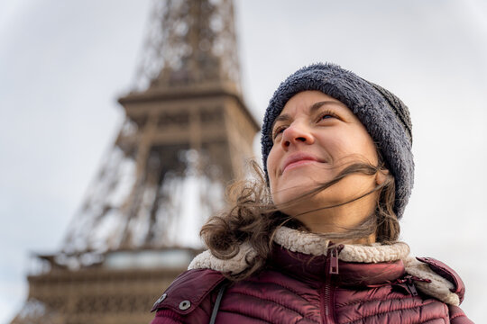 Woman exploring Paris with Eiffel Tower background