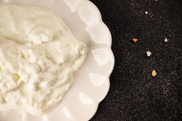 Stracciatella cheese soft young portion size Italian food natural product tasty snack fresh delicious gourmet food background on the table rustic top view copy space