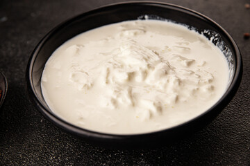 Stracciatella cheese soft young portion size Italian food natural product tasty snack fresh delicious gourmet food background on the table rustic top view copy space