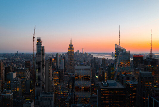 New York City skyline during sunset with iconic buildings