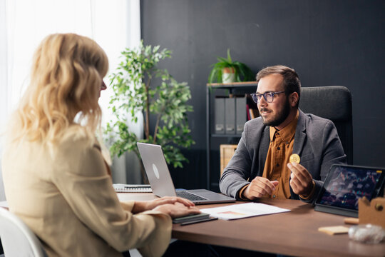 Financial advisor discussing cryptocurrency investment with client