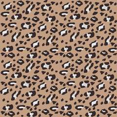 Stylized leopard print seamless pattern. Modern wild animal spot background on a brown backdrop. Trendy and simple cheetah skin illustration for fashion fabric, textile print, or cool wallpaper.