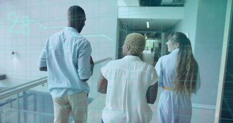 Three professionals walking corridor man turning head initiating business talk with floating graphs