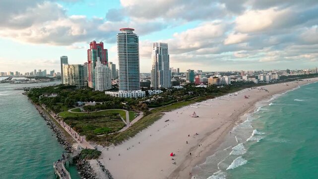 South pointe. Skyscraper architecture in Miami. Miami south beach aerial sunset. Skyscraper at south pointe park. Luxury hotel skyscraper. Aerial Miami beach. Luxury aerial landscape. Zoom in