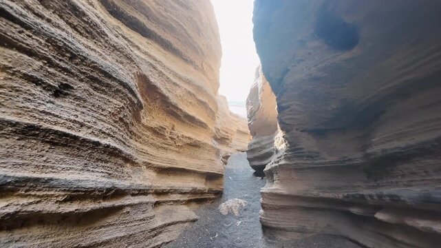 Fascinating journey exploring the layered volcanic rock formations of a narrow canyon