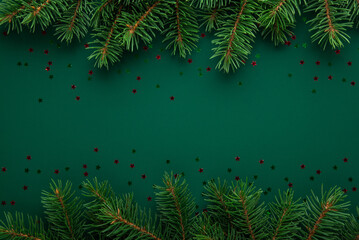Christmas frame with xmas tree on green background. Merry Christmas card. Winter holiday theme. Happy New Year. Space for text