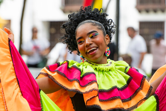 Joyful Caribbean dancer in vibrant costume, Cartagena de Indias