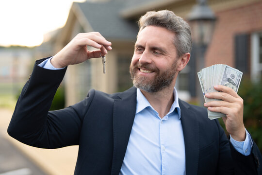 Fototapeta A realtor hands keys to a happy homeowner. Real estate agent inspects an apartment interior. Agent explains property financing. A real estate broker stands confidently outside a residential building.