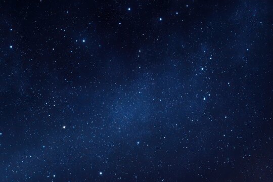 A dark blue celestial expanse filled with thousands of twinkling stars, evoking the vastness of space
