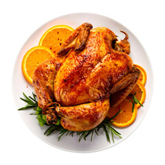 A golden-brown roasted bird, garnished with orange slices and herbs on a white plate