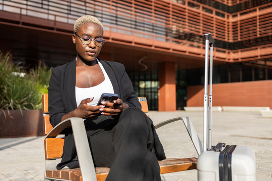 Businesswoman using smartphone during a break