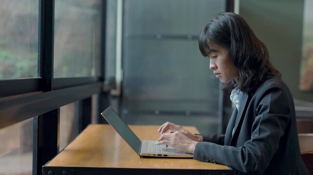 Professional legal consultant in office typing on laptop, symbolizing modern law work and legal consulting.