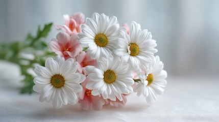 Obraz premium Fresh White Daisies and Pink Flowers in a Beautiful Bouquet on a Soft Background, Perfect for Spring Decor and Nature Inspired Arrangements