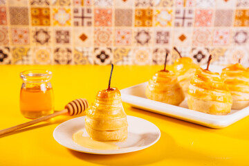 Pears in puff pastry dough drizzled with honey. Healthy and organic food.