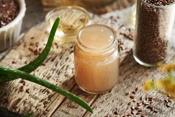 Homemade flax seed gel, aloe vera, apple cider vinegar - ingredients for natural diy shampoo. Alternative no poo haircare.