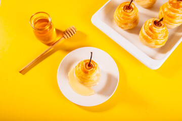 Pears in puff pastry dough drizzled with honey. Healthy and organic food.