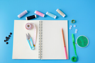 Sewing accessories and supplies tools with book note.