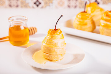 Pears in puff pastry dough drizzled with honey. Healthy and organic food.