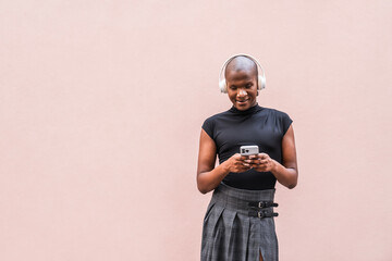 Young man with headphones using smartphone