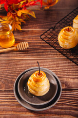 Pears in puff pastry dough drizzled with honey. Healthy and organic food.