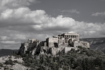 Black and white of the Acropolis of Athens. Grey clouds at the sky.