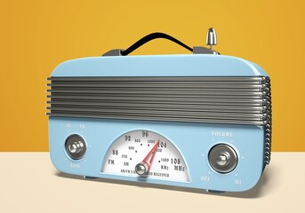 old retro blue radio receiver on yellow background,