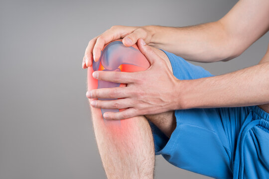 Knee pain, joint inflammation, arthritis and degenerative changes, man suffering from leg ache and doing self-massage