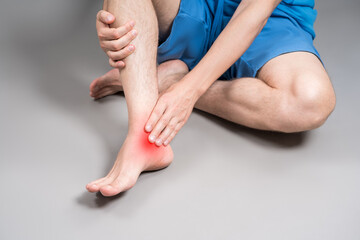 Achilles tendon injury, joint inflammation, foot pain, man suffering from feet ache, podiatry...