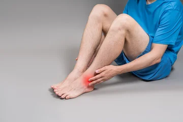 Fotobehang Beren Achilles tendon injury, joint inflammation, foot pain, man suffering from feet ache, podiatry concept  © staras