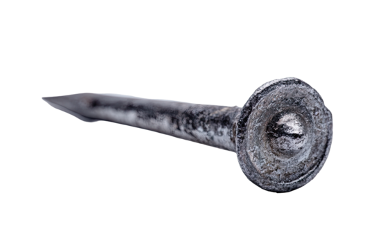 Close-up of a single, rusty, metallic nail.  The nail's head is slightly domed and shows signs of wear.  The shaft is long and pointed.  Isolated on a black background