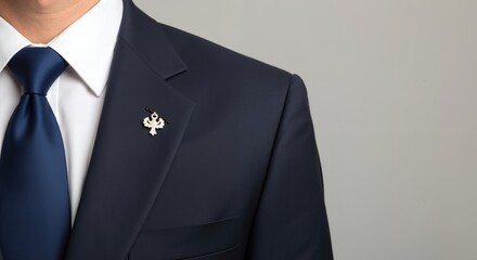 Businessman wearing formal dark blue suit with gold lapel pin. Close-up detail of corporate attire. Professional elegance concept with copy space