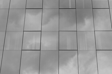 Rectangular light gray floor tiles arranged in a clean linear pattern creating a soft minimalist indoor architectural surface