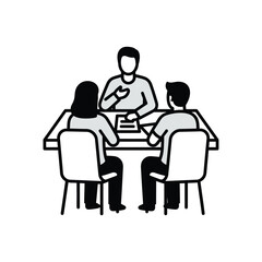 People meeting around a table discussing documents