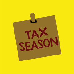 yellow sticky note with tax season text finance