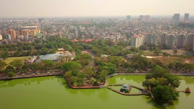  Futuristic aerial view panorama of developing Yangon city , Aerial view of Sule pagoda in downtown, Yangon, Myanmar. Sule Pagoda located in the heart of Yangon, Karaweik royal barge, Kandawgyi Lake, 