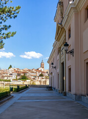 Fototapeta premium A far away view of Segovia's downtown from the front plaza of the Alcazar castle, providing a sweeping panorama of the historic Segovian city skyline and the distant downtown