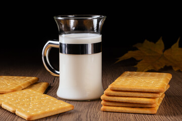 Refreshing milk and tasty crackers arranged on a vintage kitchen table