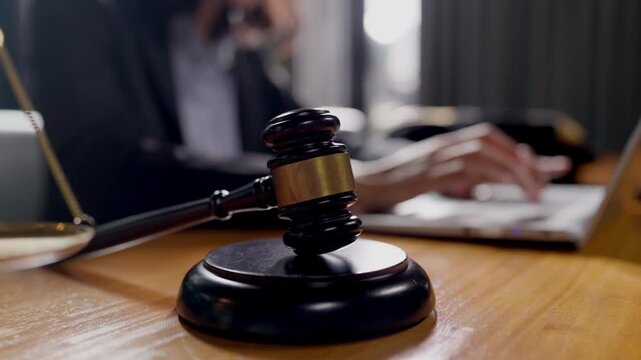 Symbolic photo for law and justice content balance scale gavel and laptop on lawyer s desk.