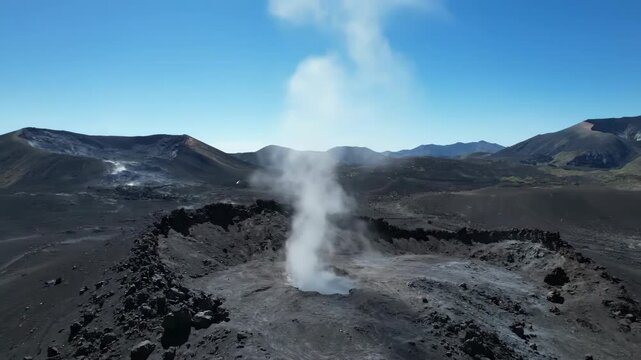 Drone slowly rising from a volcanic landscape, revealing a plume of fine volcanic dust from a fumarole at midday crater, active volcano, earth's power