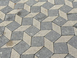 Geometric interlocking paving stones pattern on outdoor pathway