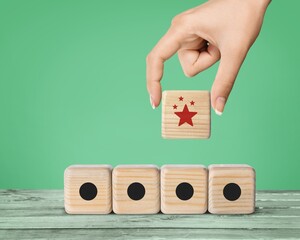 Differentiation, marketing strategy. Wooden blocks with star