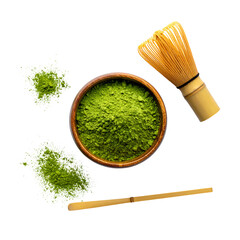 Overhead shot of matcha powder in a wooden bowl, with a whisk and scattered powder