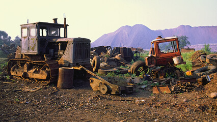 Industrial landfill with transport waste in the background.